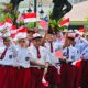 Senyum Anak Negeri di Istana: Pelajar Sambut Presiden Prabowo dan PM Anwar dengan Hangat